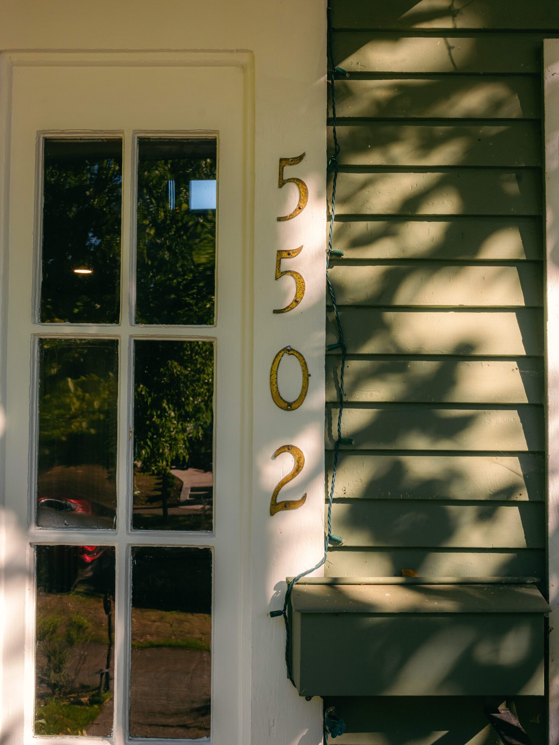 Vintage gold numbers display the spa address 5502 34th Ave NE, Seattle 98105